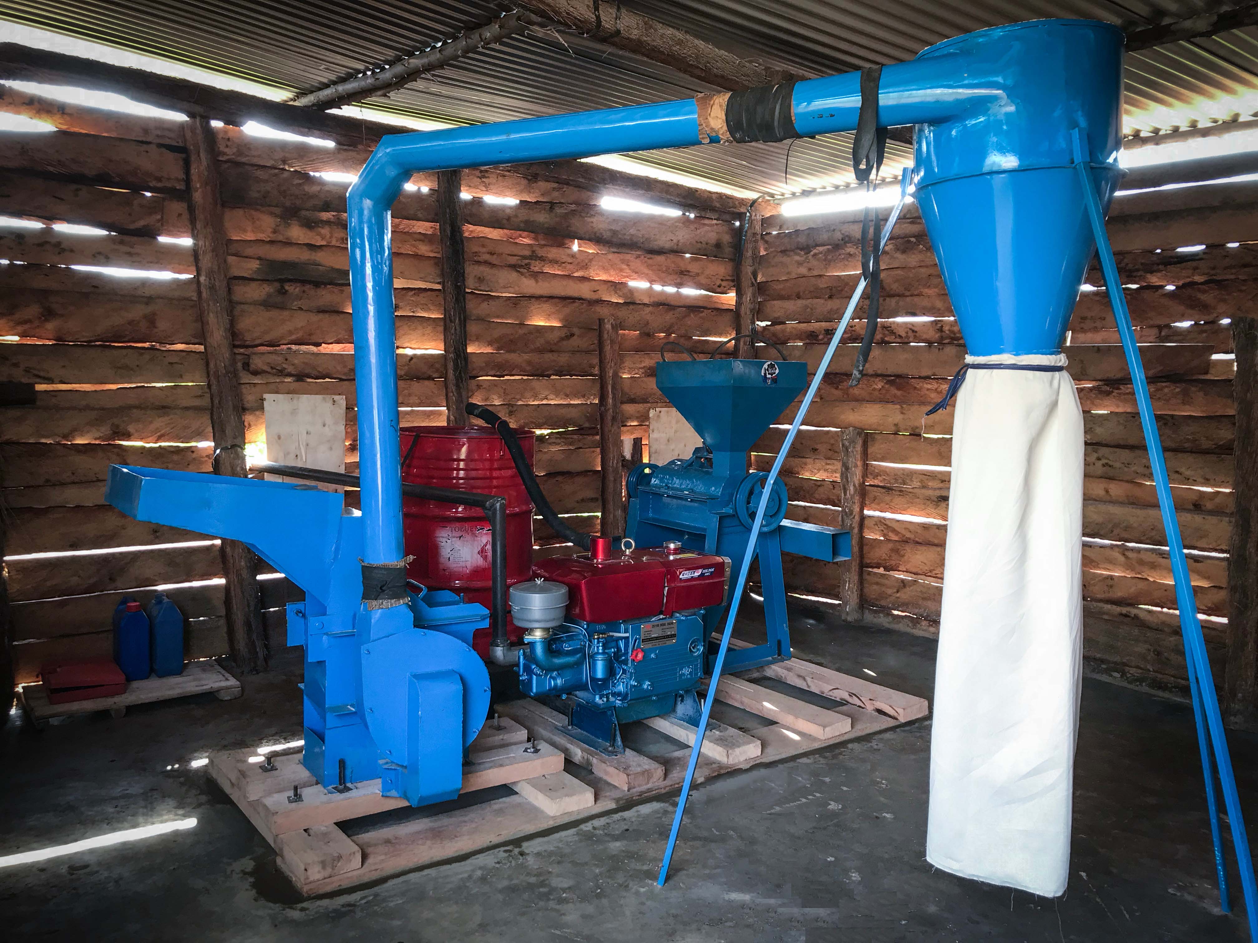 The operational Lacac Pe Lony maize milling machine inside the building